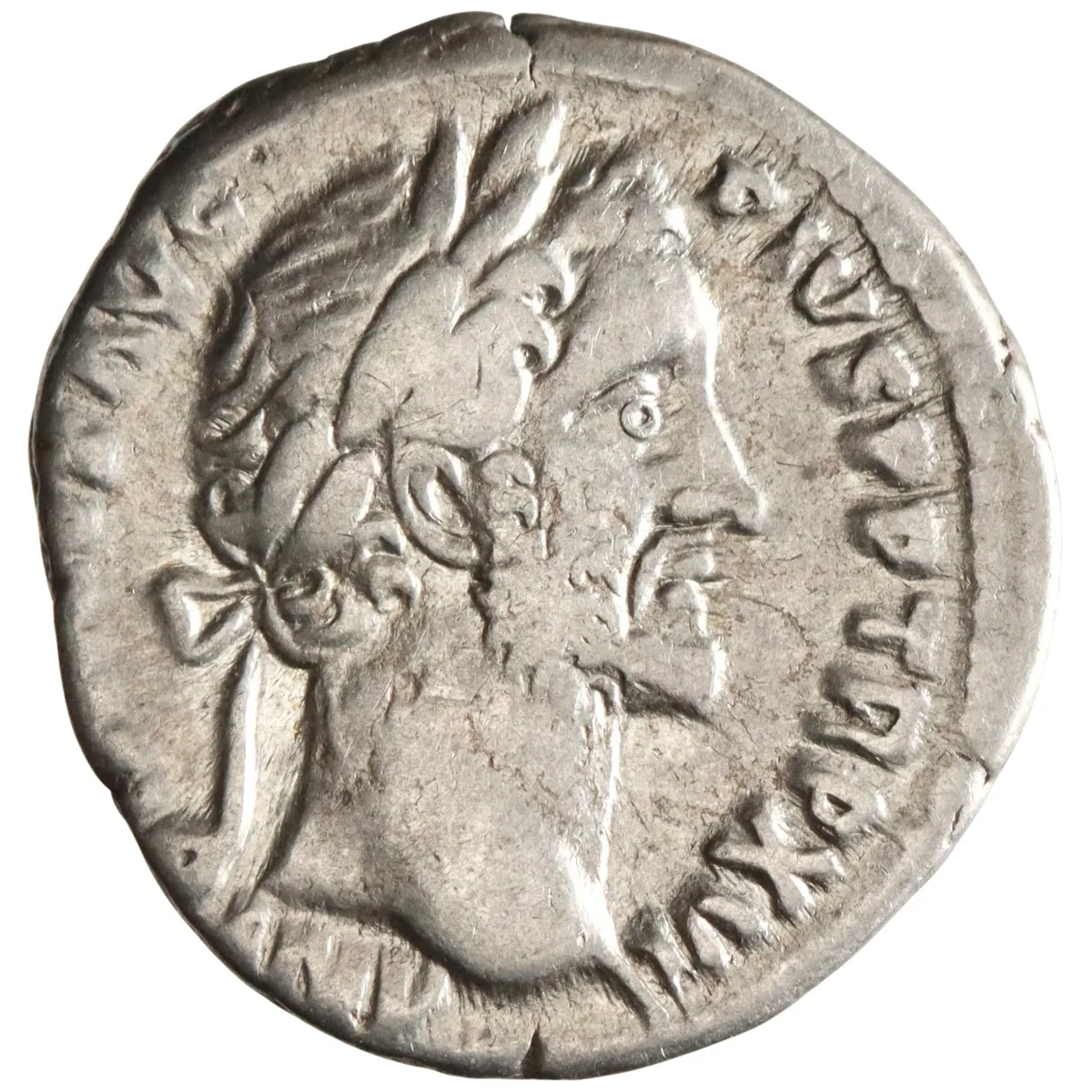 Roman: Antoninus Pius (138-161), silver denarius (3.46g), Rome mint, 148-149 CE. Laureate head right / Annona standing left, holding corn-ears and resting hand on modius set on prow to right.