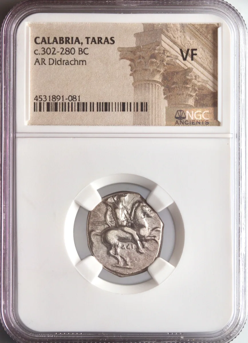 Calabria, Tarentum: silver didrachm, 302-280 BCE. Horse rider / Taras on dolphin, holding spear and shield. NGC VF.