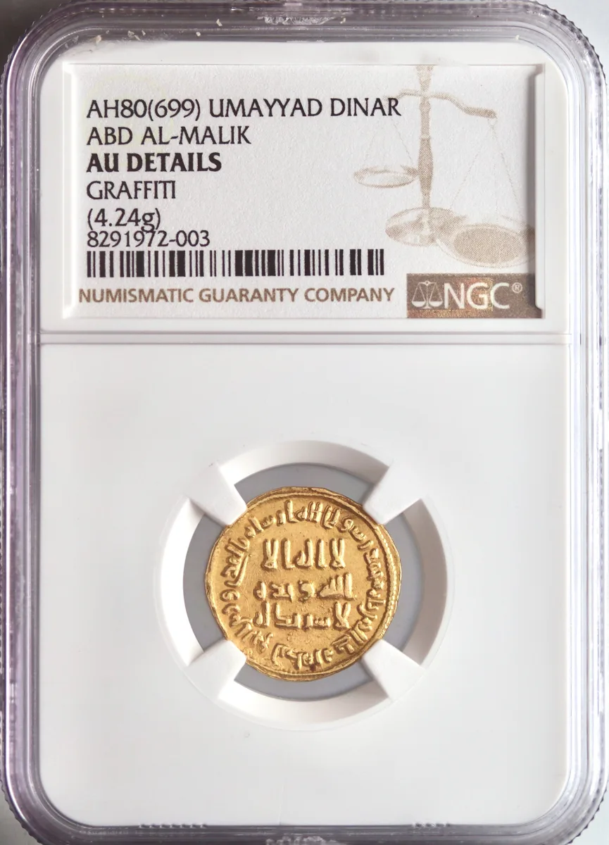 Umayyad: 'Abd al-Malik (685-705), gold dinar (4.24g), AH 80 (699-700 CE). Early date. NGC AU Details -Graffiti.