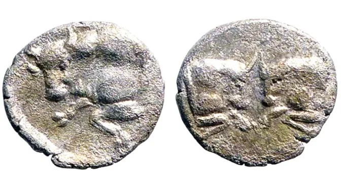 Caria, Uncertain mint. 5th century BC, AR 8mm .30gm hemiobol. Bull / Bull's