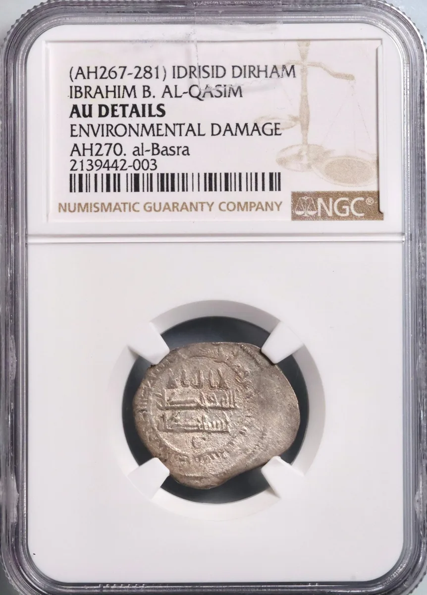 Idrisid: Ibrahim ibn al-Qasim (880-899), silver dirham, al-Basra (in Morocco) mint, AH 270 (883-884 CE). NGC AU Details -Environmental Damage. Extremely rare.