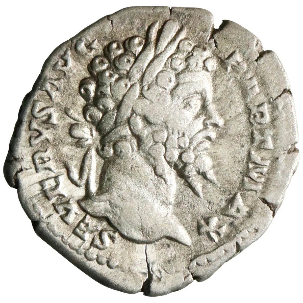 Roman: Septimius Severus (193-211), silver denarius (3.42g), Rome mint, 193-211 CE. Victory flying left holding open wreath in both hands over round shield set on low base.
