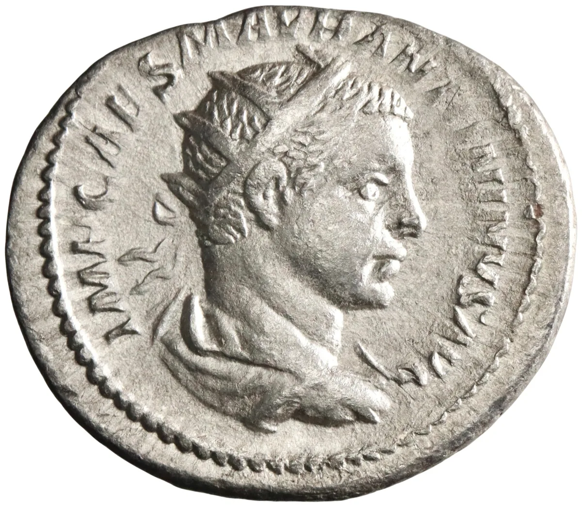 Roman: Elagabalus (218-222), silver antoninianus (4.80g), Rome mint, 218-222 CE. Radiate, draped, and cuirassed bust / Victory walking right, holding wreath and palm branch.