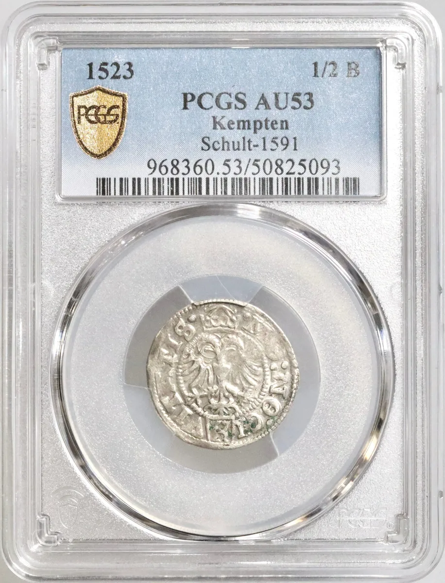 Kempten: silver 1/2 batzen, 1523 CE. Shield of 3-fold arms of Austria, Burgundy and Tyrol in circle, date at end of legend / Crowned double-headed imperial eagle in circle, small shield with 'K' at bottom. PCGS AU53.