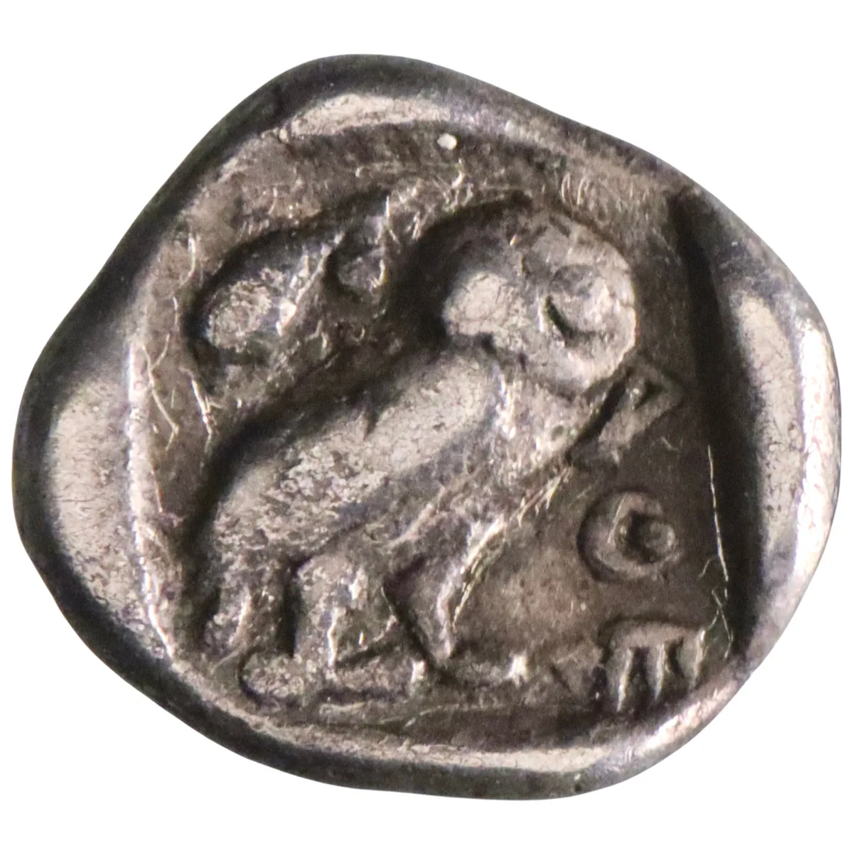 Attica, Athens: silver hemiobol (0.34g), 454-404 BCE. Helmeted head of Athena / Owl standing.
