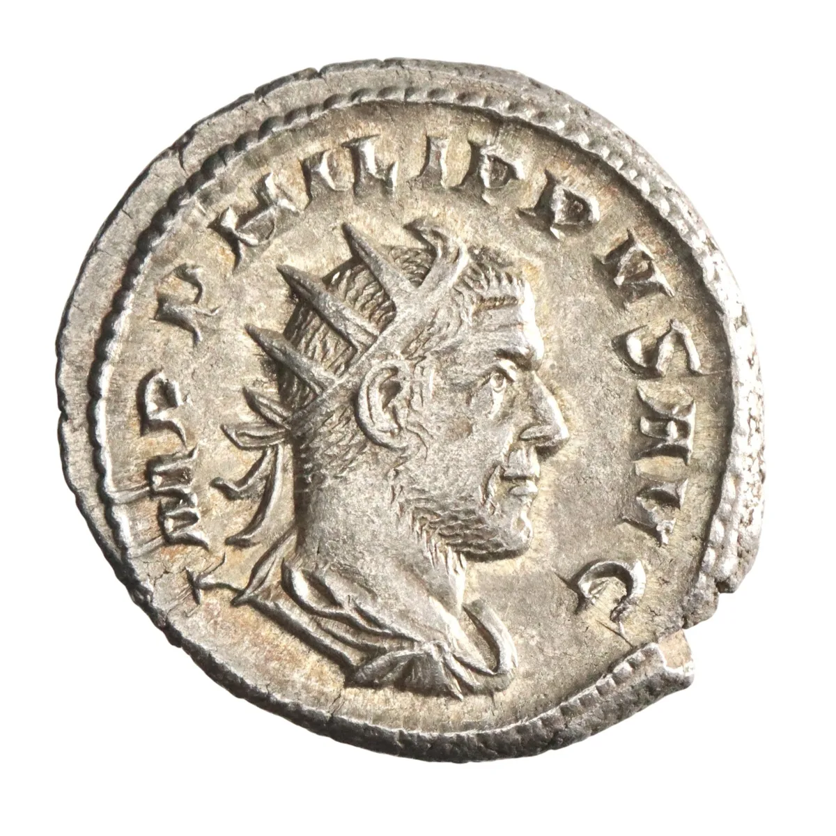 Roman: Philip I 'the Arab' (244-249), silver antoninianus (3.96g), Rome mint, 244-249 CE. Radiate, draped, and cuirassed bust / Roma seated, holding spear and Victory.